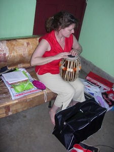 Jacky trying out the new tabla drums she's just bought